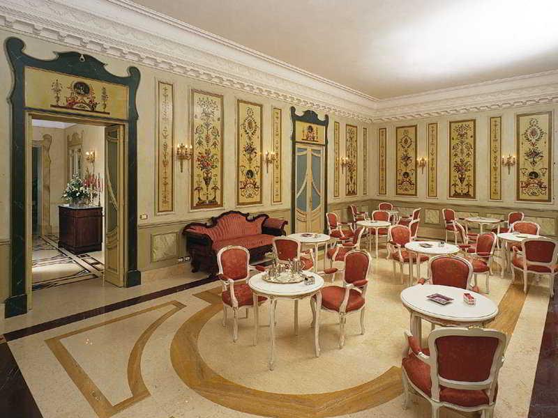 Una Hotels One كاتانيا المطعم الصورة